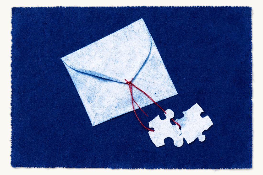 Competition clearance for buying a business in Turkey: a large closed envelope tied with a red thread that leads to two interlocking jigsaw pieces, cyanotype print