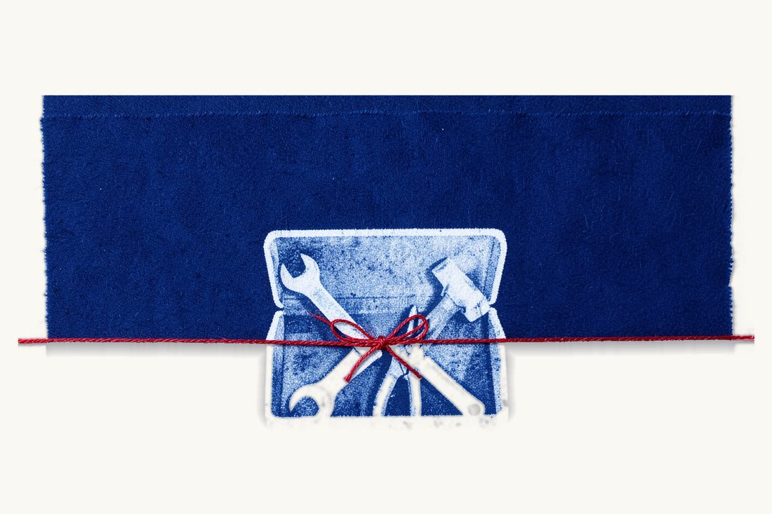 Essential clauses of a commercial contract: an open toolbox holding a wrench, a screwdriver, pliers and a hammer, tied round with a red thread, cyanotype print