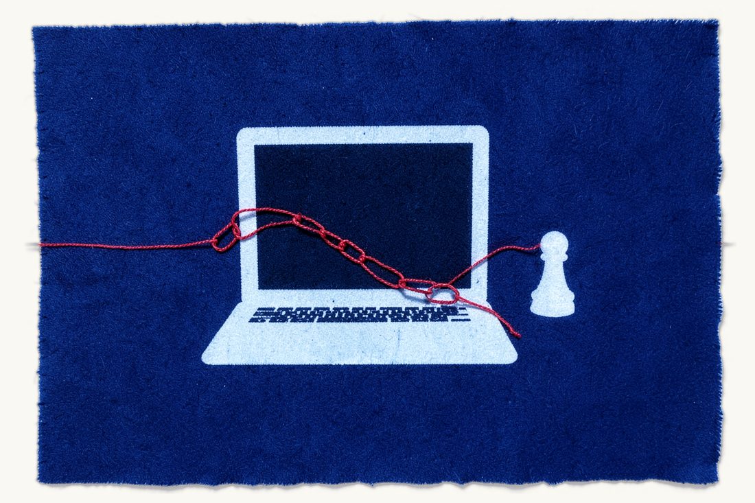 Cybercrime and cybersecurity risks for businesses: a laptop with a dark blank screen, a chain with one broken link draped across it, red thread fraying at the break, a chess pawn at right, cyanotype print