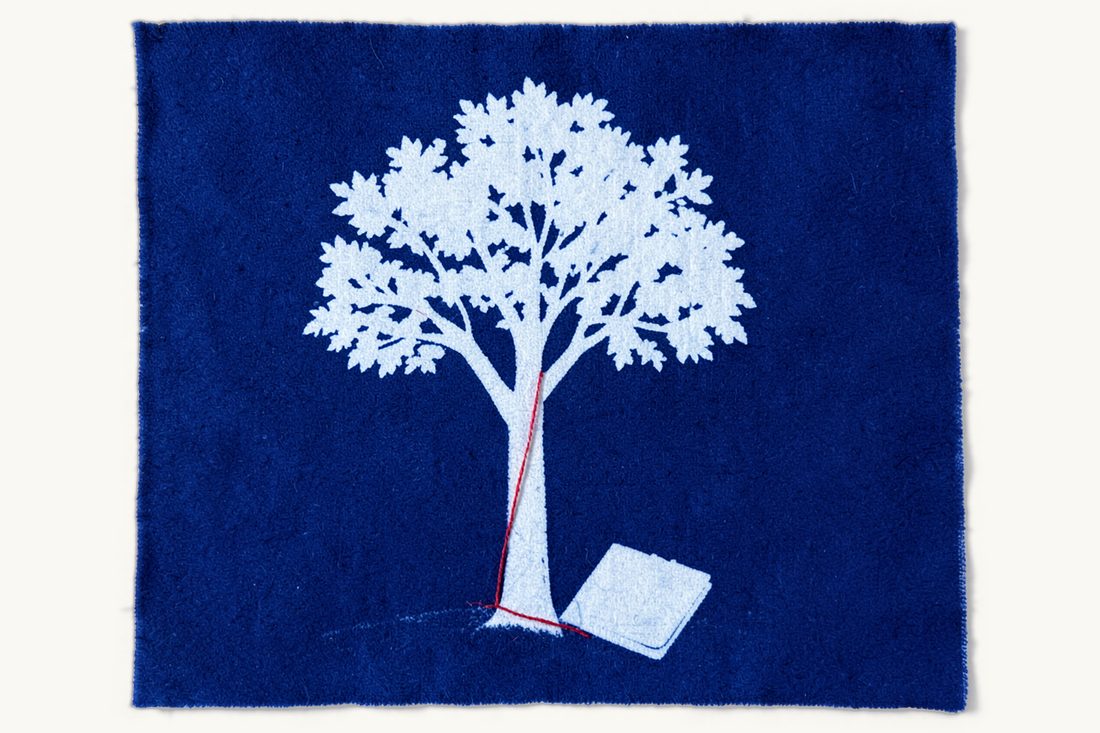 Dual nationality formalities between the US and Turkey: a leafy tree with a red thread running down its trunk and along the ground to a document folder, cyanotype print