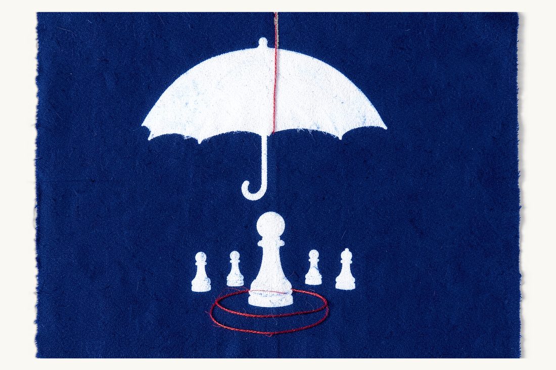 Building leniency into a competition compliance programme: an open umbrella sheltering the one pawn that stepped forward first, four pawns left behind, a red thread ring, cyanotype print