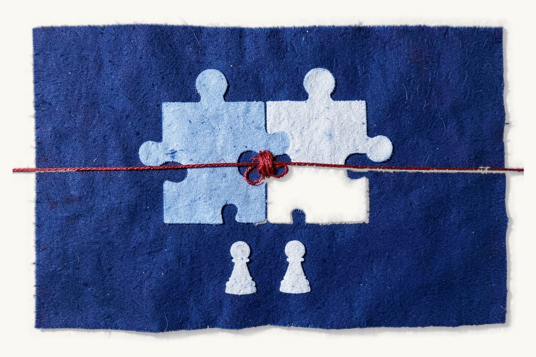 Company mergers under Turkish law: a cyanotype print in Prussian blue of two white jigsaw pieces fitted together, a knotted red thread at their join and two small chess pawns below