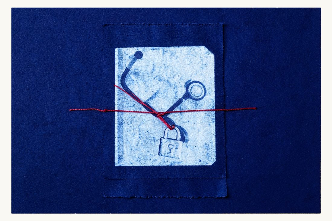 Handling sensitive data in recruitment: a large document folder with a stethoscope resting on it, wound with red thread whose two ends are joined by a small closed padlock, cyanotype print