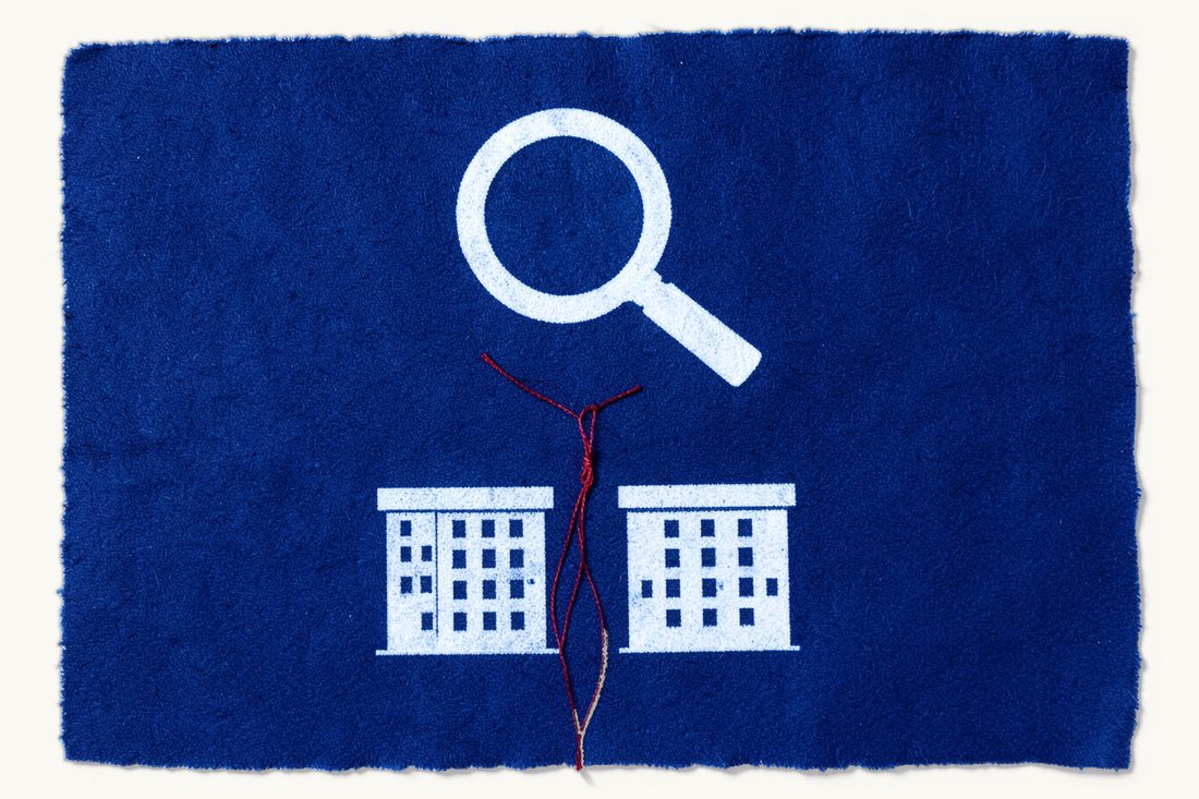 Turkish competition law for foreign firms: a large magnifying glass hanging above two identical office blocks, a red thread tied in a tight knot between them, cyanotype print
