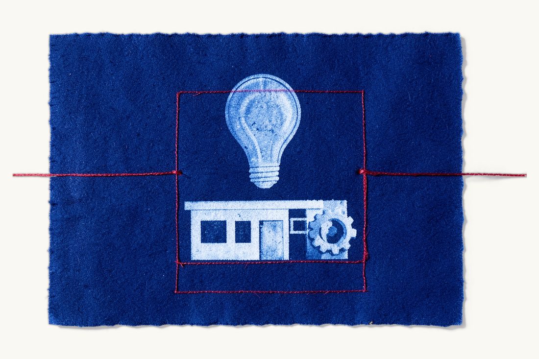 Technology development zones in Türkiye: a red rectangle framing a glowing lightbulb above a low office block, with a gear wheel beside the building, cyanotype print