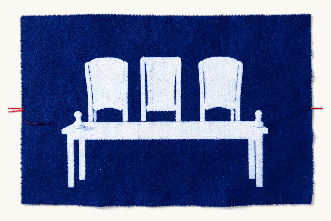 Arbitration and dispute resolution in Türkiye: three empty high-backed chairs behind a long table, with two chess pawns linked by a red thread in front, cyanotype print
