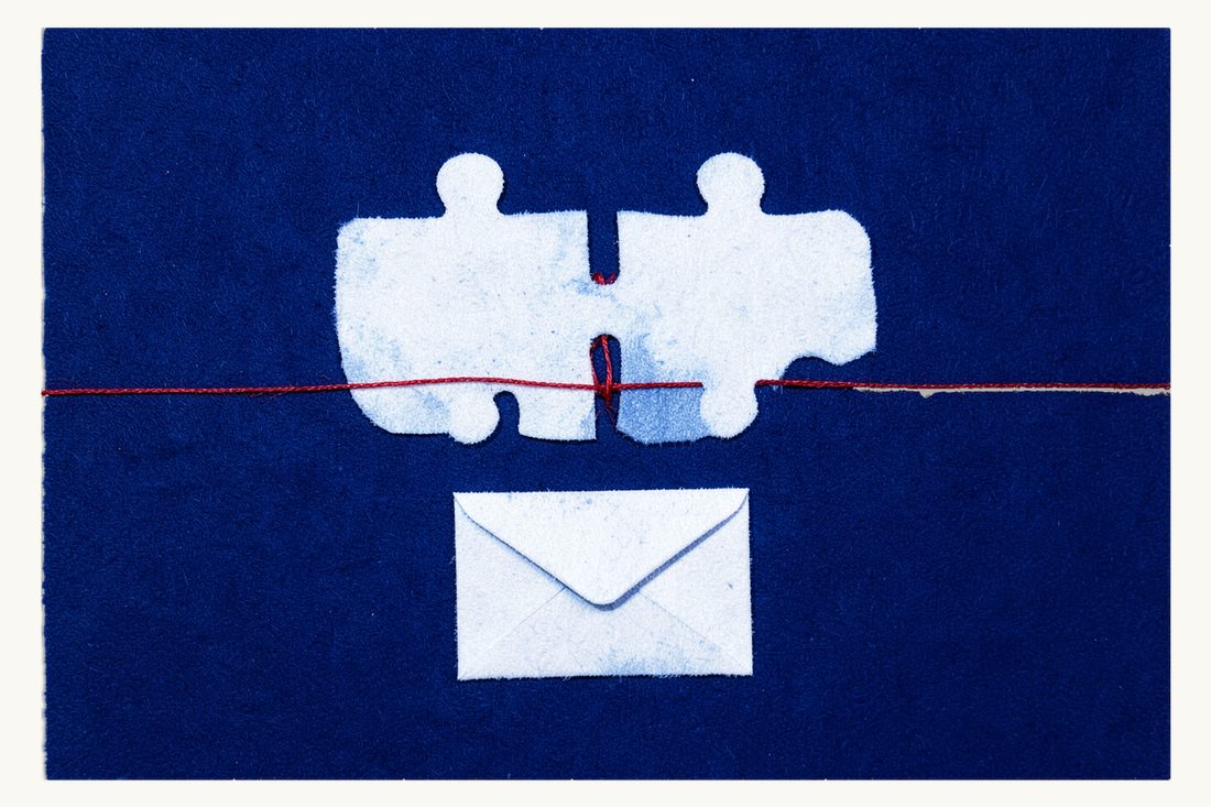 Merger control before closing: two large jigsaw pieces kept apart by a red thread wound round their joint, a closed envelope below, cyanotype print