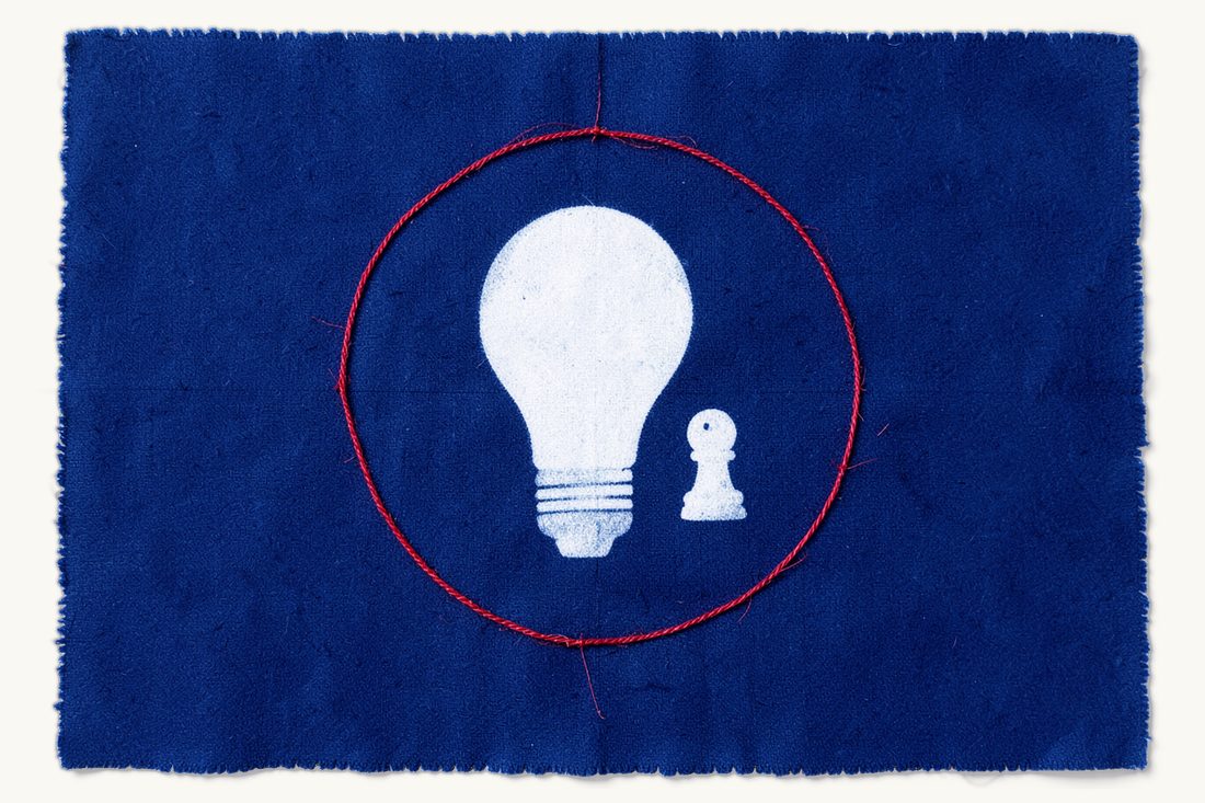 Intellectual property law in Türkiye: a large lightbulb inside a wide protective circle of red thread, with a small pawn standing beside the bulb, cyanotype print