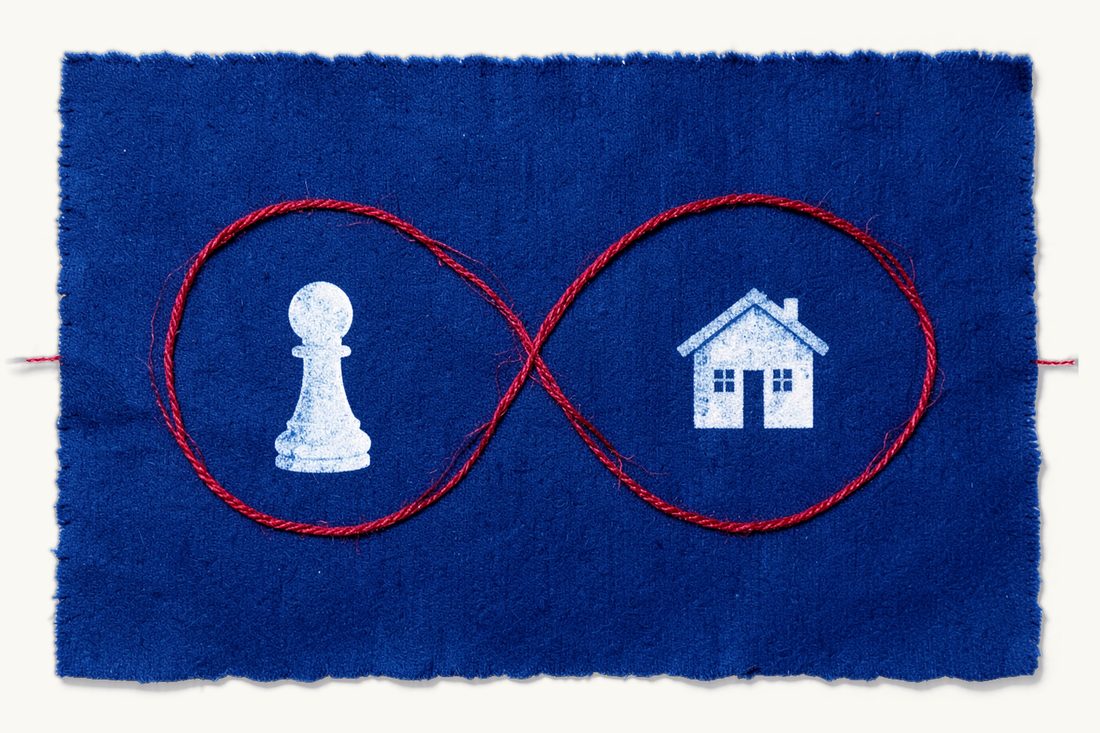 Long-term residence with no fixed end date: a red thread laid as one large unbroken infinity loop, a white chess pawn in one loop and a small house in the other, cyanotype print